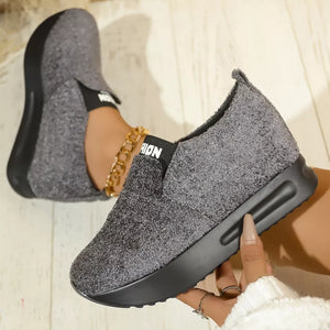 Textured gray round toe platform sneakers with black sole and elastic band detail.