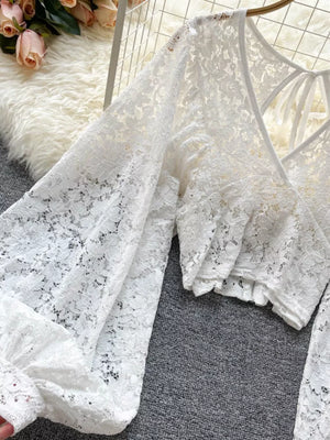 White sheer floral lace cropped shirt with balloon sleeves and tie-back detail.
