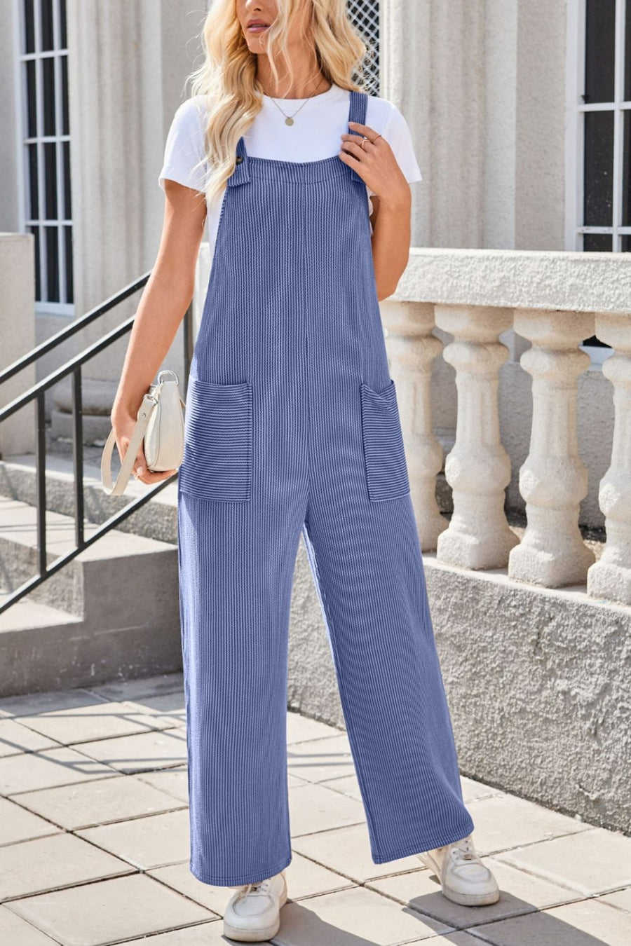 Dusty Blue striped denim overalls with patch pockets and wide legs.