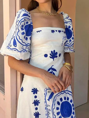 white maxi dress with ruched and puff sleeve
