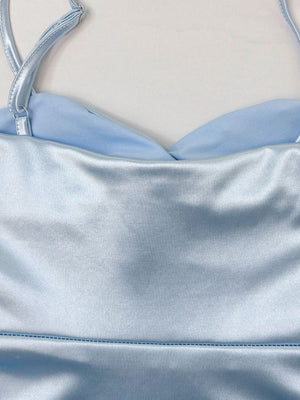 Light blue satin cami with sweetheart neckline and adjustable straps.