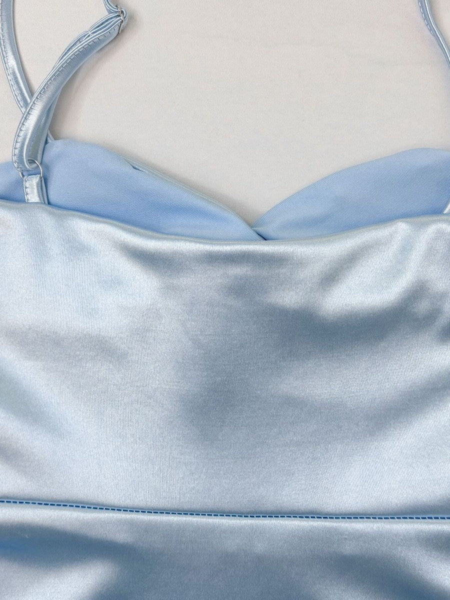Light blue satin cami with sweetheart neckline and adjustable straps.