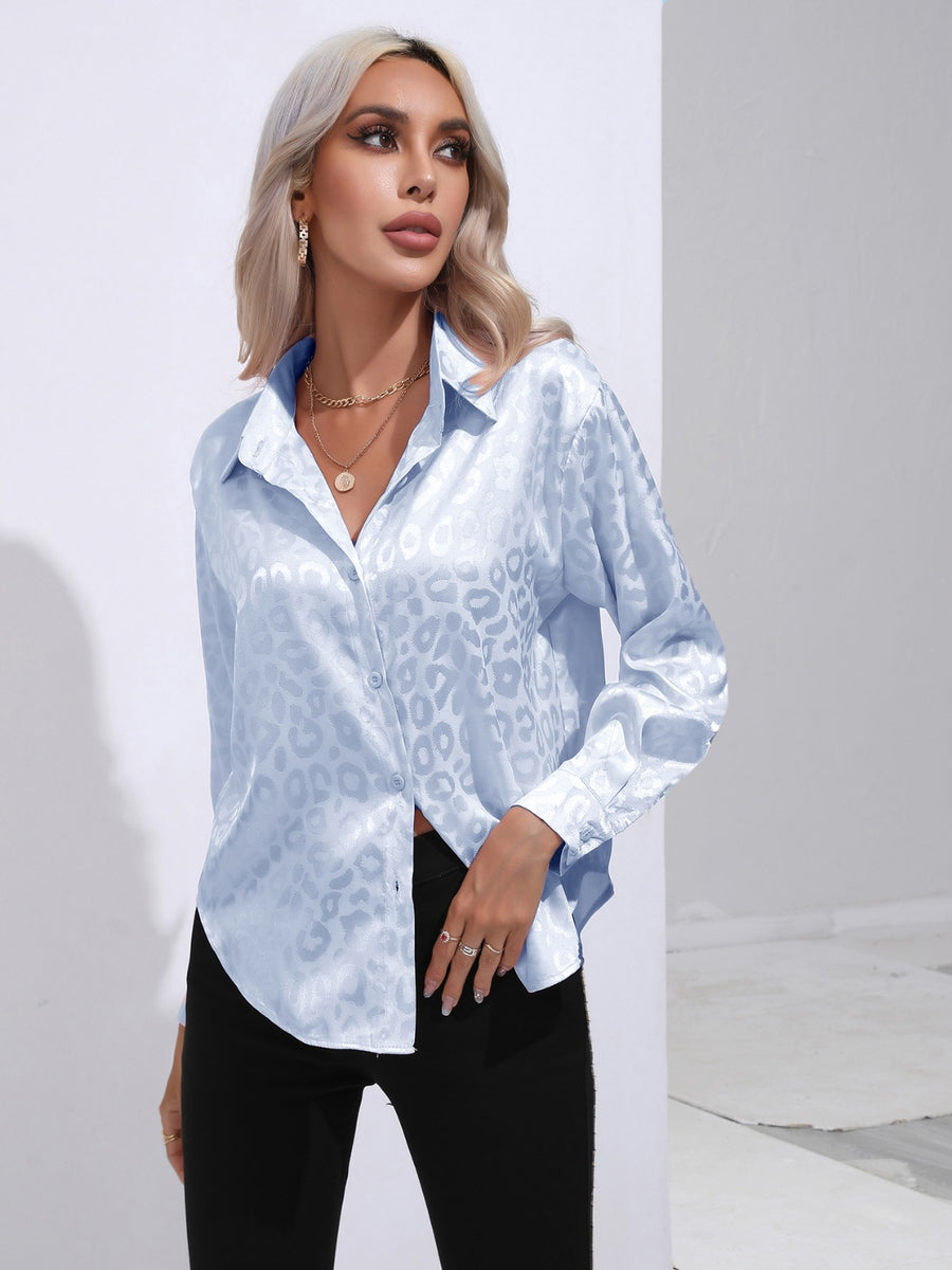 Light blue satin leopard print blouse with button front and long sleeves