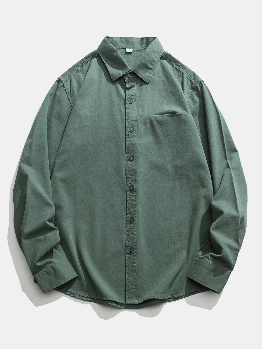 Men's green cotton button-down shirt with chest pocket and classic collar.