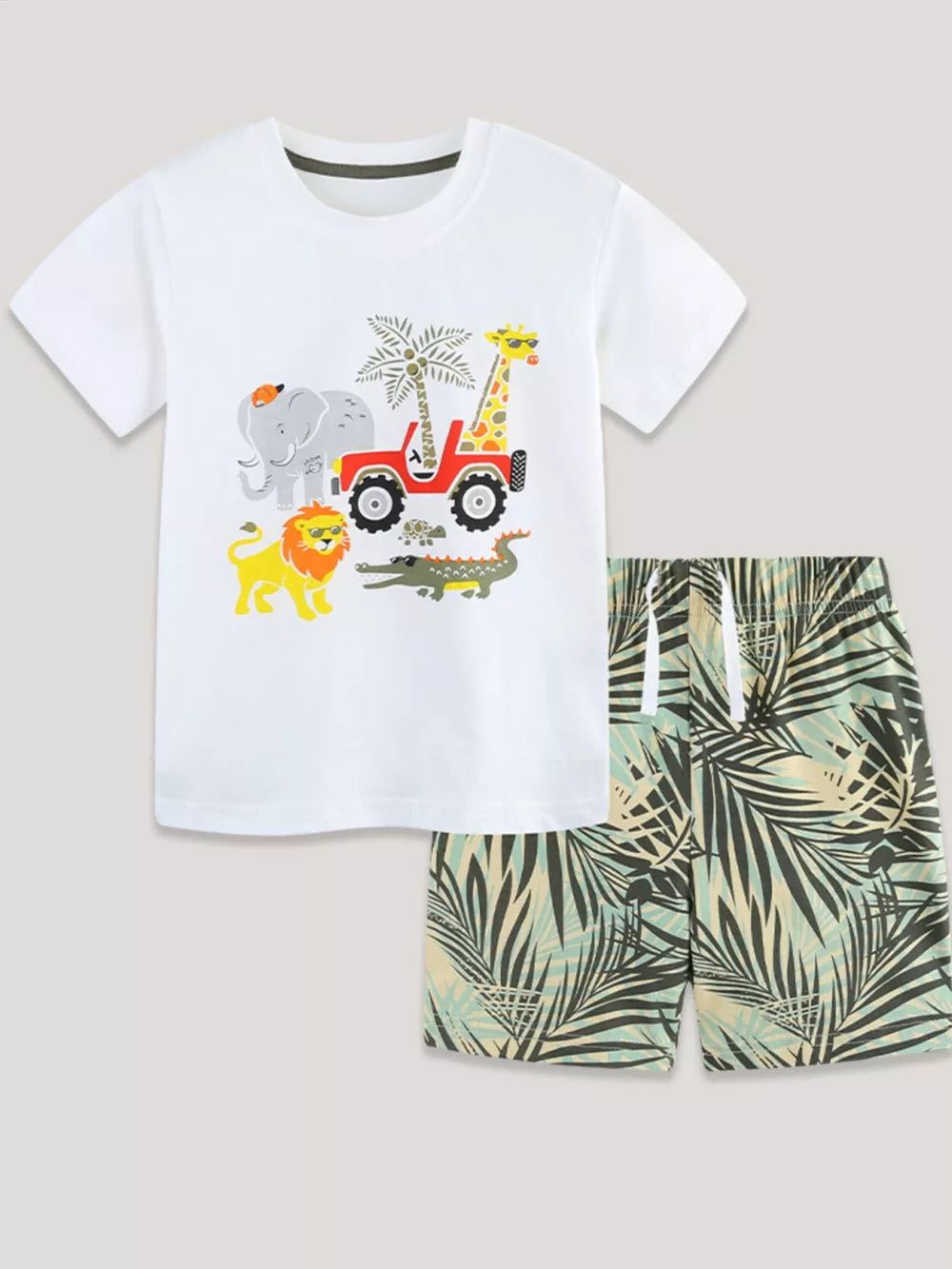 White cotton baby tee with safari graphic and palm print shorts.