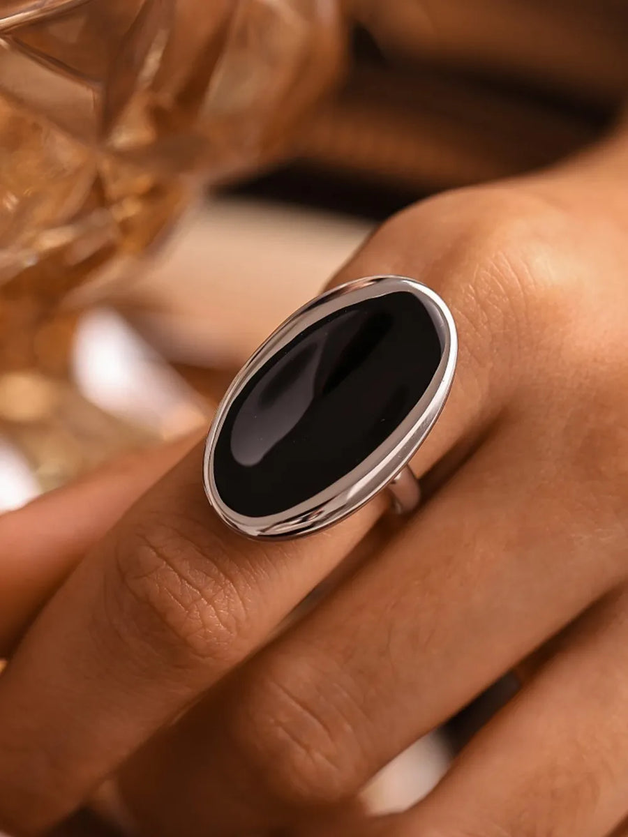 Silver cocktail ring with sculpted oval onyx stone