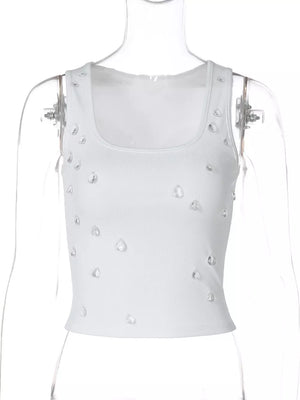 White ribbed cropped tank top with scattered rhinestones and square neckline.