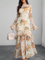 Off white floral mermaid maxi dress with flounce sleeves and tiered ruffles.