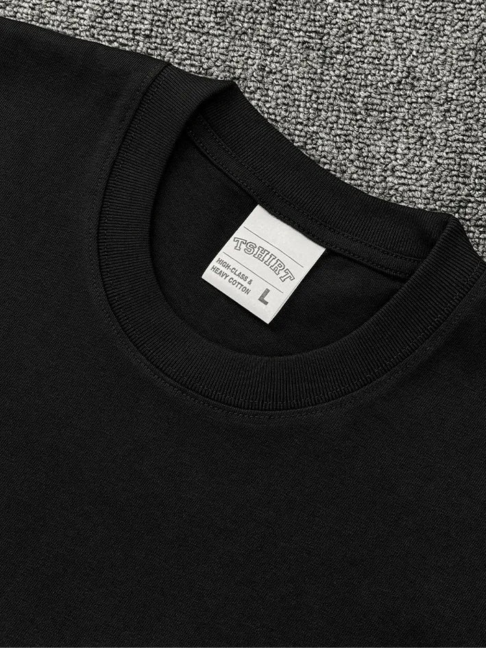 Black crew neck t-shirt with a size L tag and heavy cotton label.