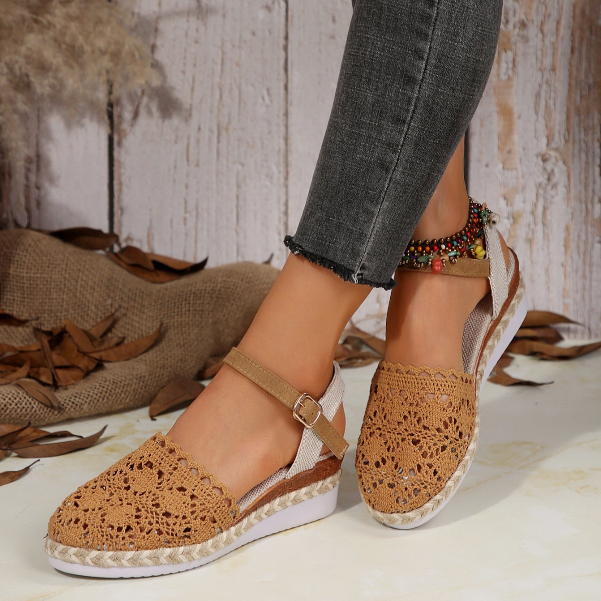 Brown crochet espadrille wedge sandals with adjustable ankle strap and peep toe.