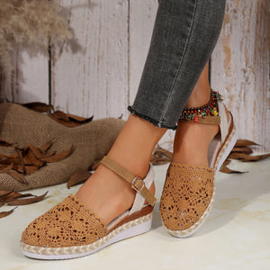 Brown crochet espadrille wedge sandals with adjustable ankle strap and peep toe.