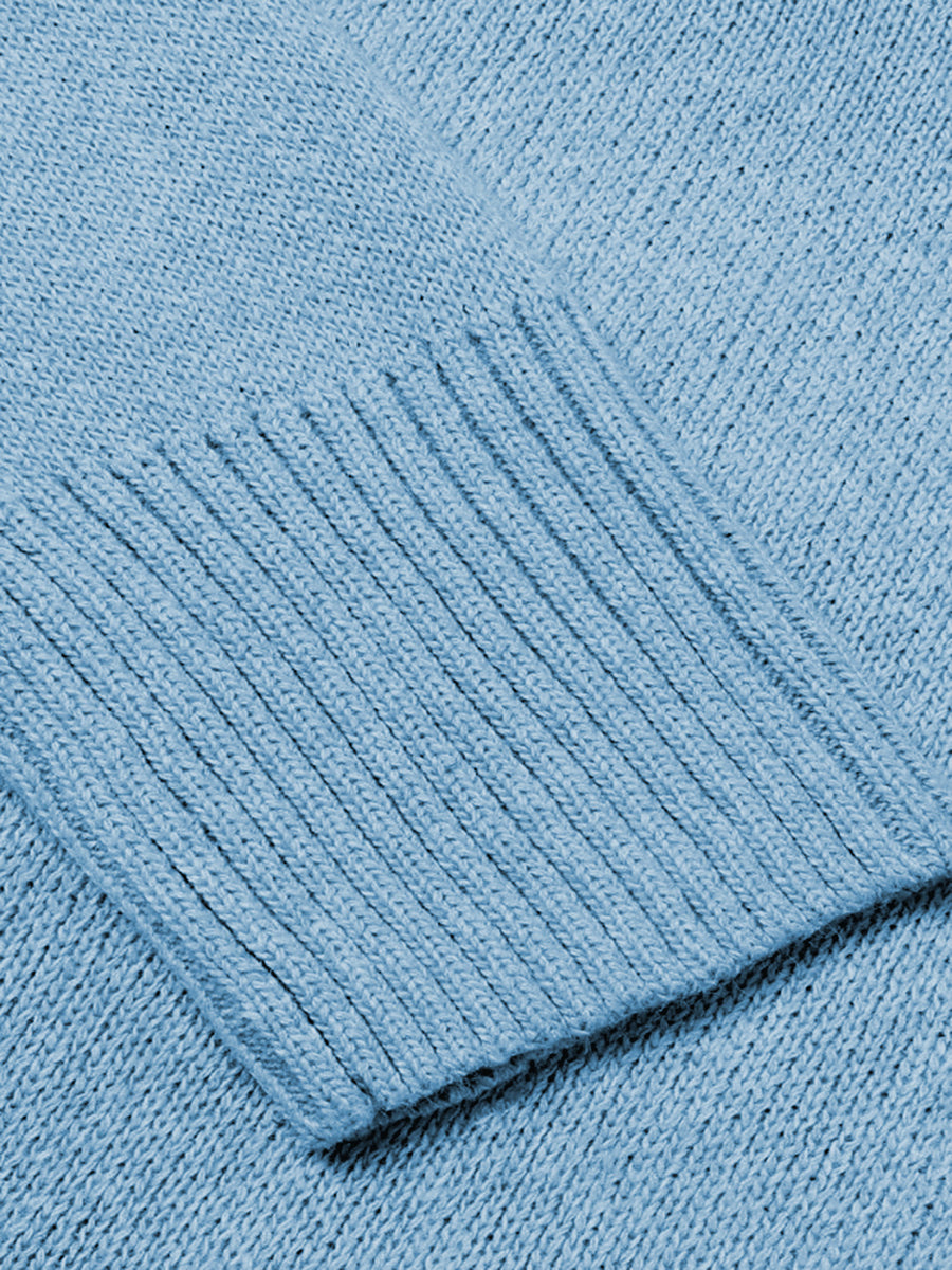 Cloudy Blue knit sweater with ribbed trim detail on the cuff.