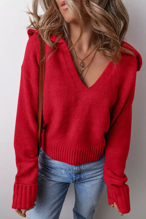 pullover sweater in red featuring ribbed hem and relaxed fit
