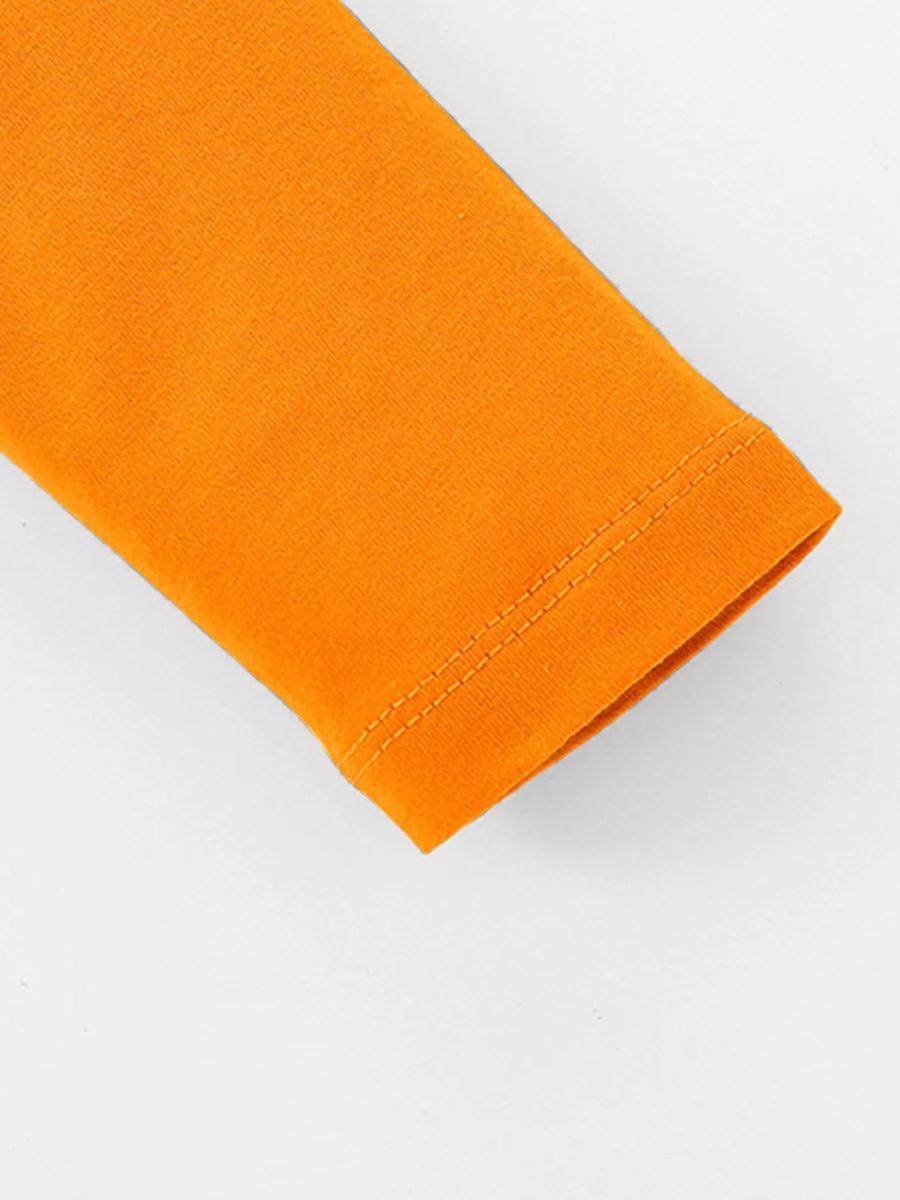Kids' tangerine orange cotton t-shirt sleeve with double-stitched hem detail.