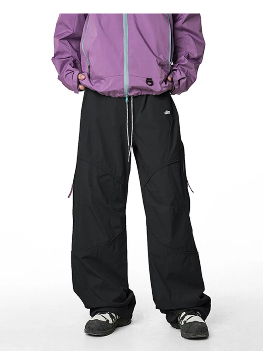Relaxed fit black cargo active pants with white drawstring and purple jacket.