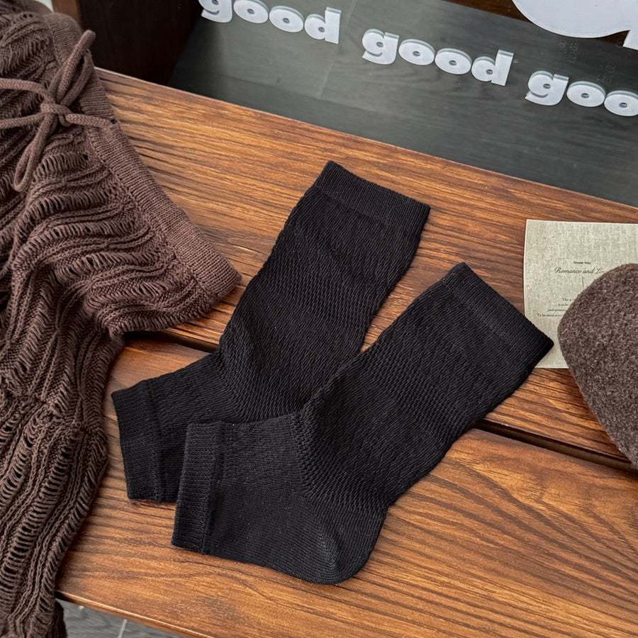 dark gray socks featuring textured knit and geometric