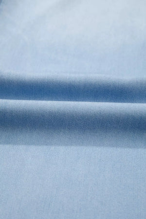 Light blue denim fabric with soft folds