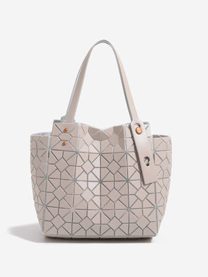 beige handbag featuring structured and geometric