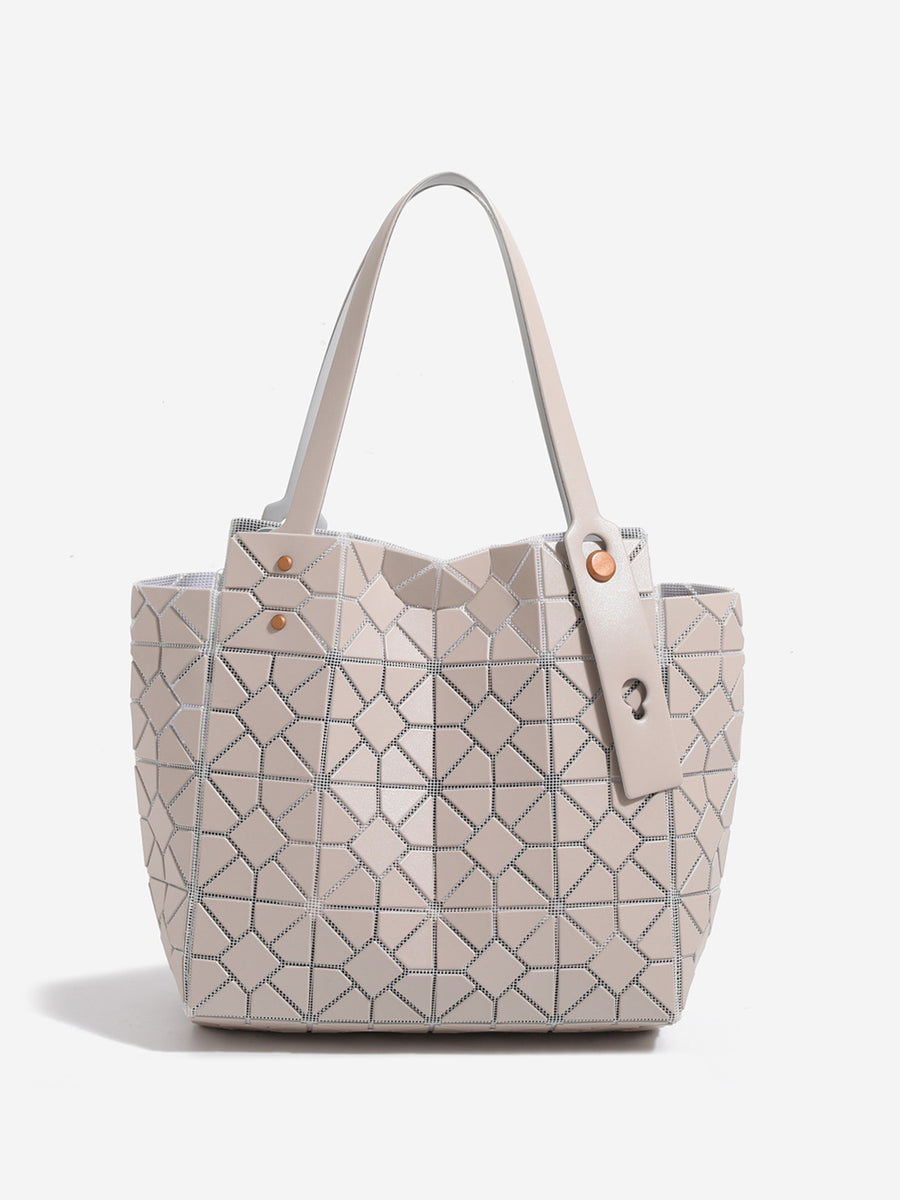 beige handbag featuring structured and geometric