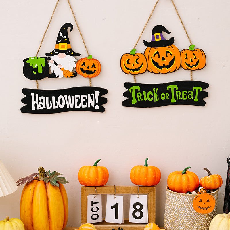 Halloween hanging signs with pumpkins, witch, gnome, and cauldron decorations.