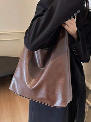 Brown PU leather tote bag with a slouchy, unstructured design.