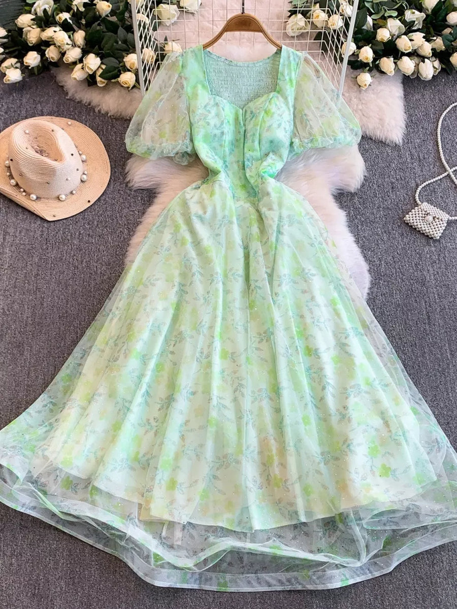 Green floral lace-embellished sweetheart maxi dress with puff sleeves and a-line skirt.