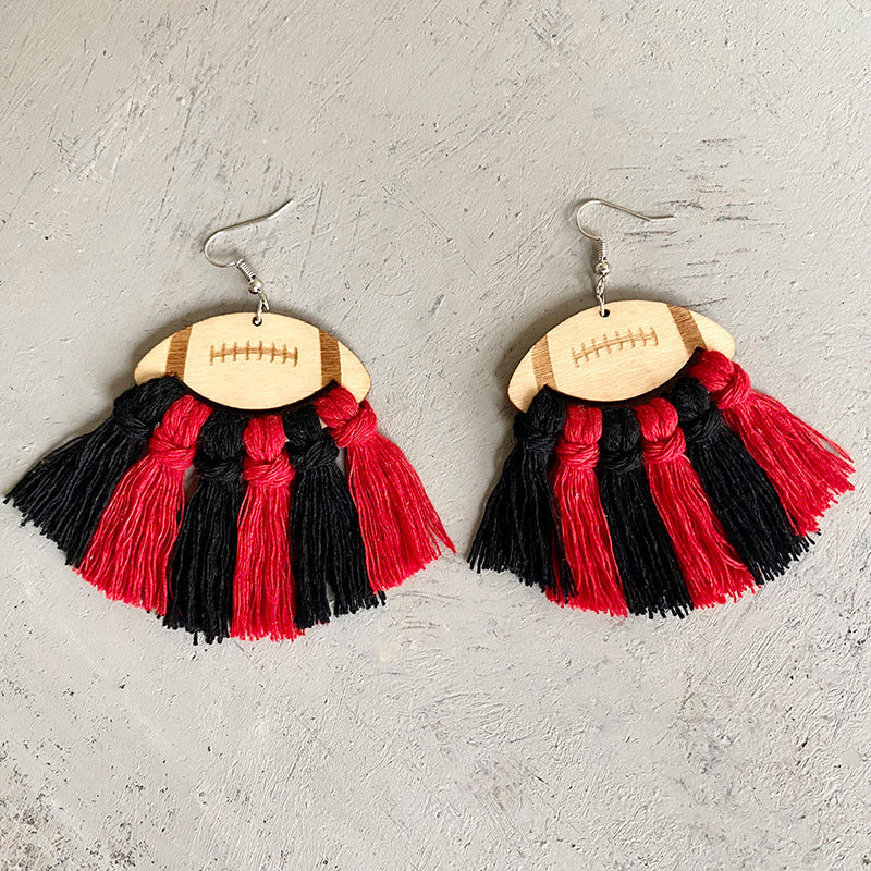 Macrame football tassel earrings in black and red with wood detail.