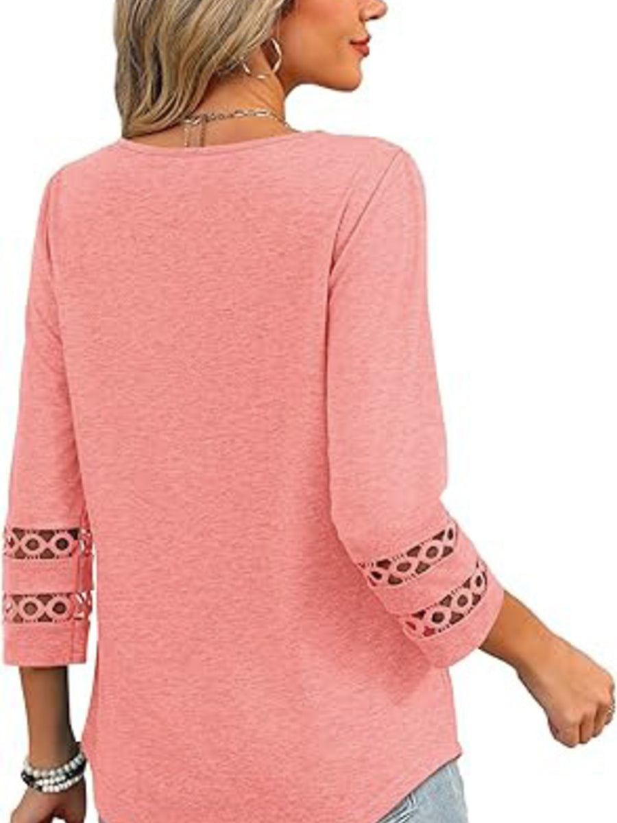 Pink 3/4 sleeve t-shirt with cutout detail on sleeves.