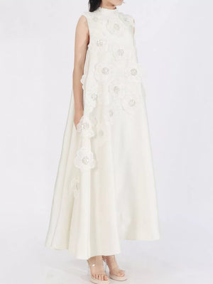 White sleeveless maxi dress with floral appliques and high neckline