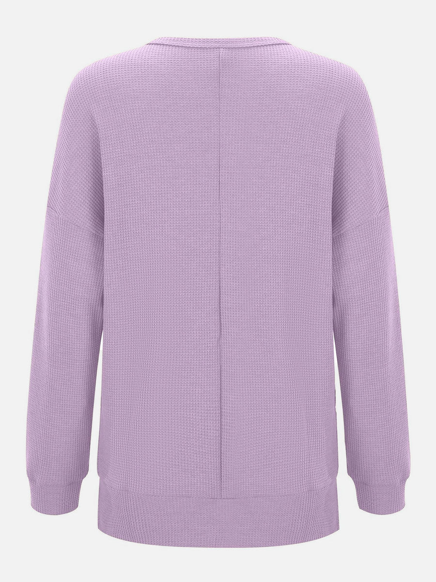Lavender waffle knit relaxed fit crewneck top with long sleeves and a seam down the back.