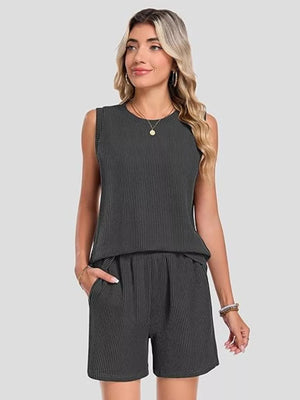 Sleek ribbed knit set in black with sleeveless top and pocketed shorts.