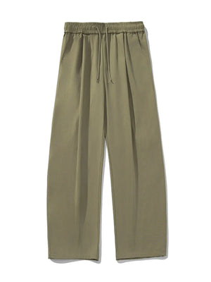 Sage balloon-fit drawstring trousers with elastic waistband and side pockets.