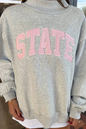 50% polyester, 50% cotton Care instructions: Machine wash cold sweatshirt in Gray with oversized silhouette