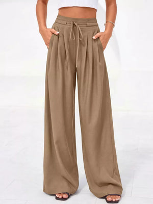 Camel high-waisted pleated wide-leg pants with drawstring and pockets.