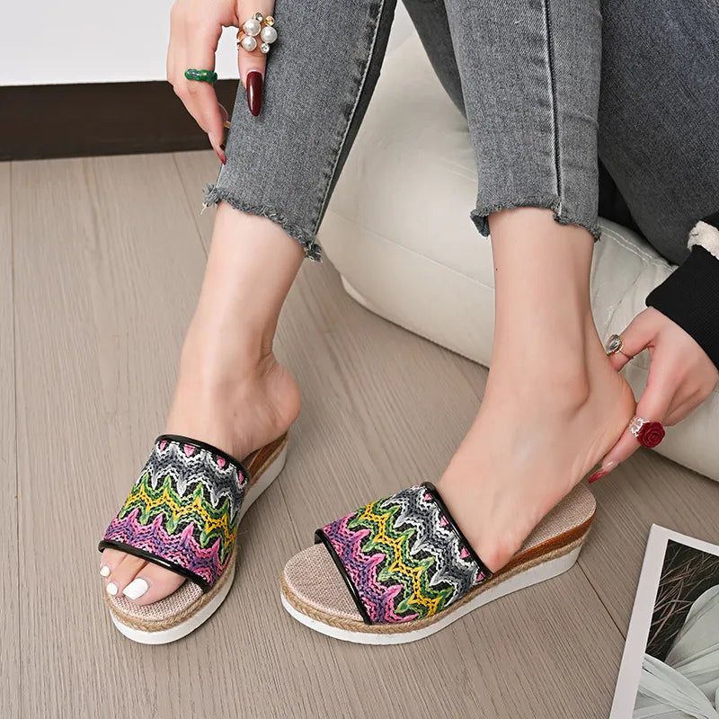 Zigzag embroidered espadrille platform slides with braided jute detail and open toe.
