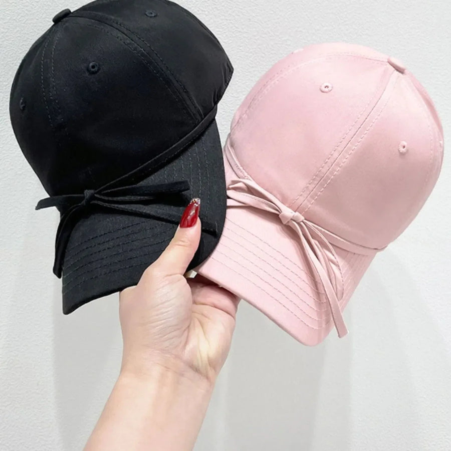 Baseball cap in blush pink and black with bow detail