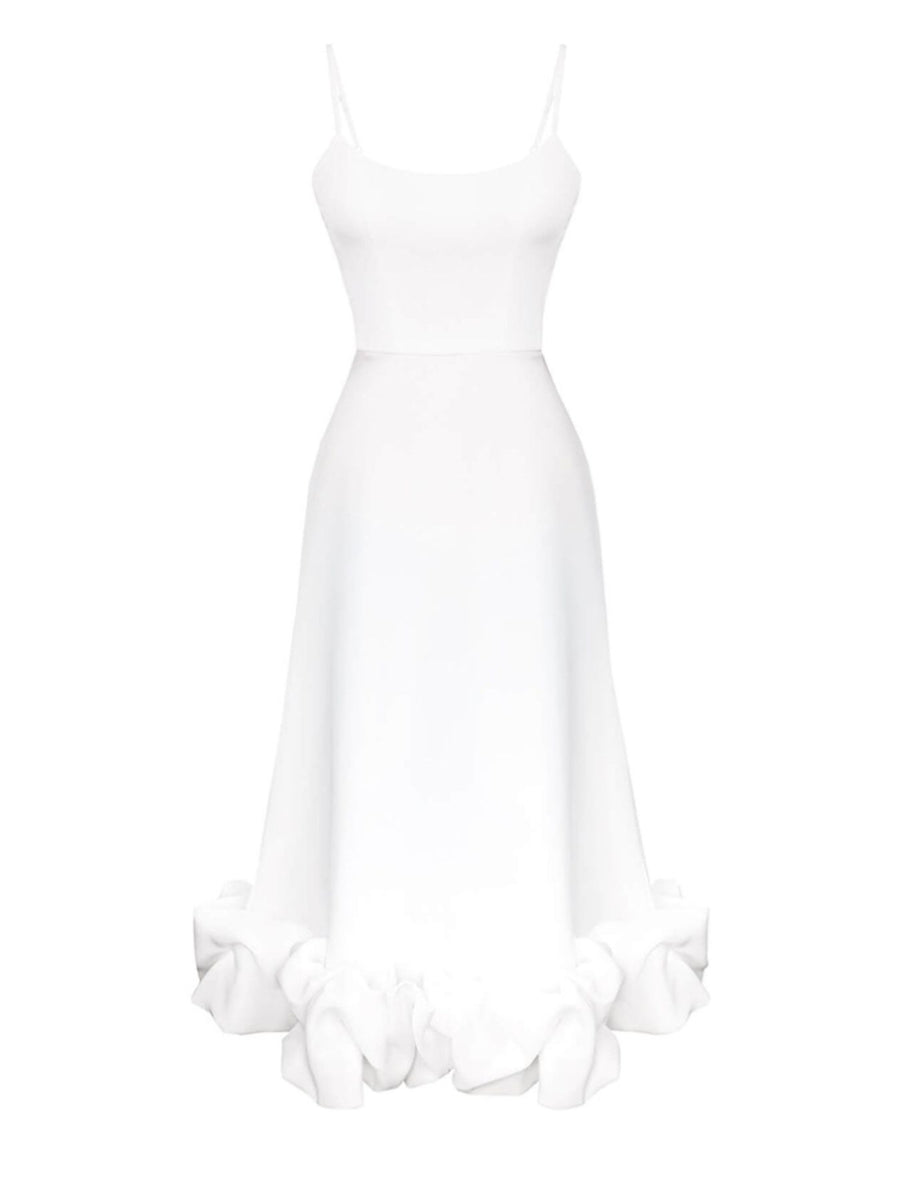 White midi dress with spaghetti straps and a ruffled hem detail.