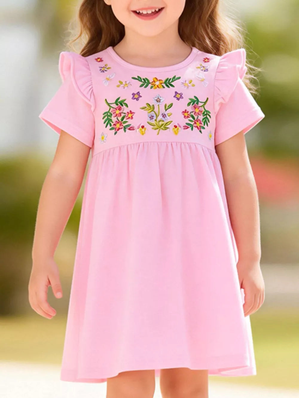 Pink cotton dress with embroidered floral detail and ruffle sleeves for baby girls.