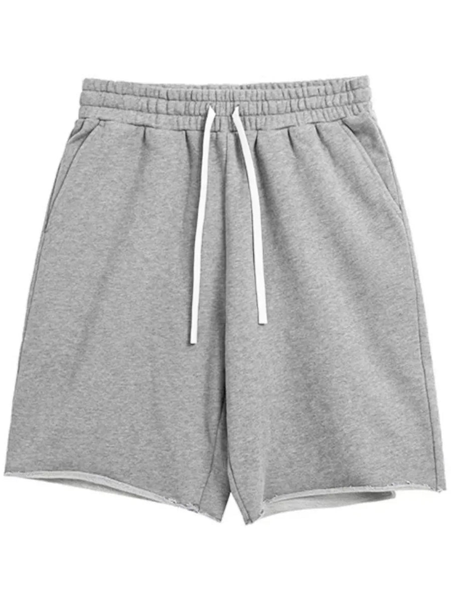 Gray relaxed fit jogger shorts with raw hem and white drawstring waist