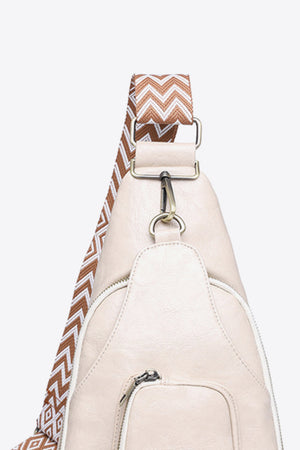 Ivory PU sling bag with chevron strap and silver hardware detail