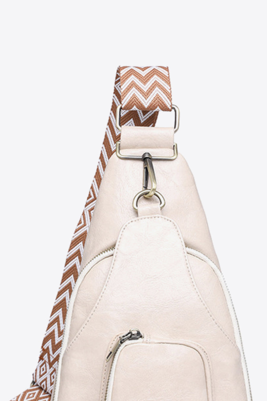 Ivory PU sling bag with chevron strap and silver hardware detail