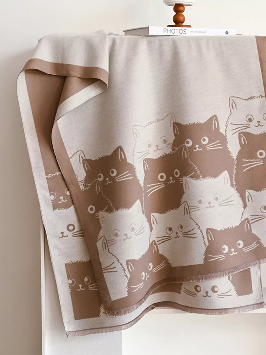 Charming reversible scarf in black brown with a cute cat pattern.
