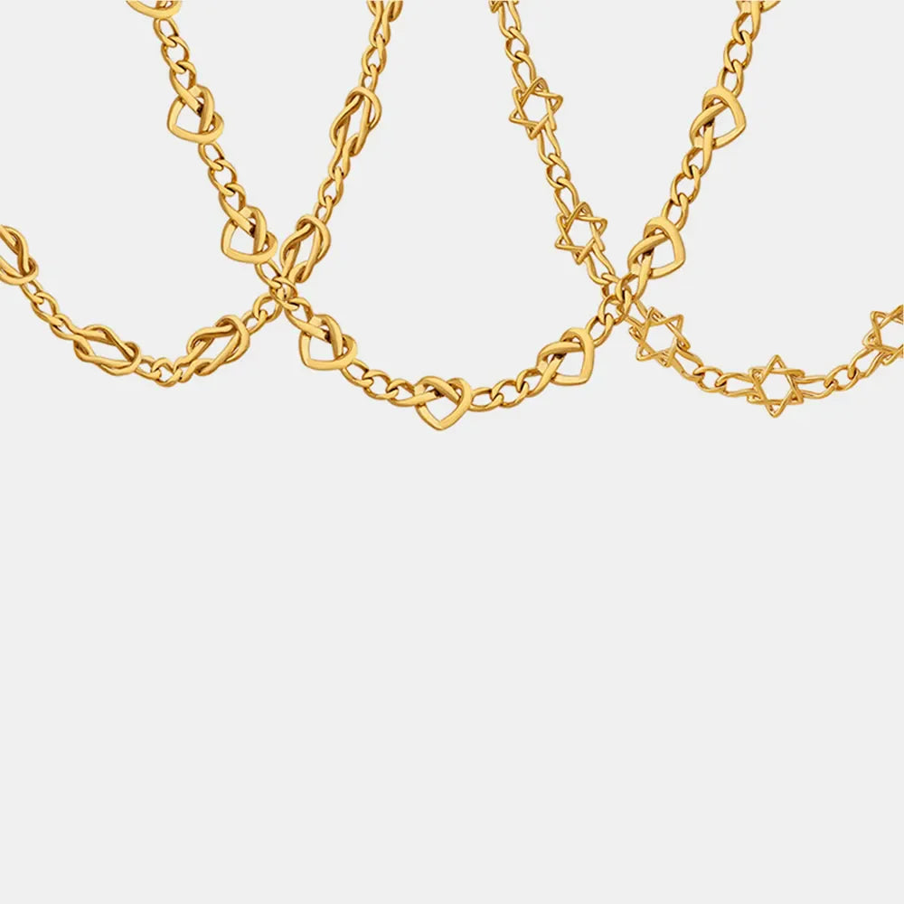 Gold brass heart link chain necklace with knot and star details
