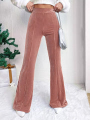 Dusty pink corduroy maternity flare pants with high waist and bell bottoms.