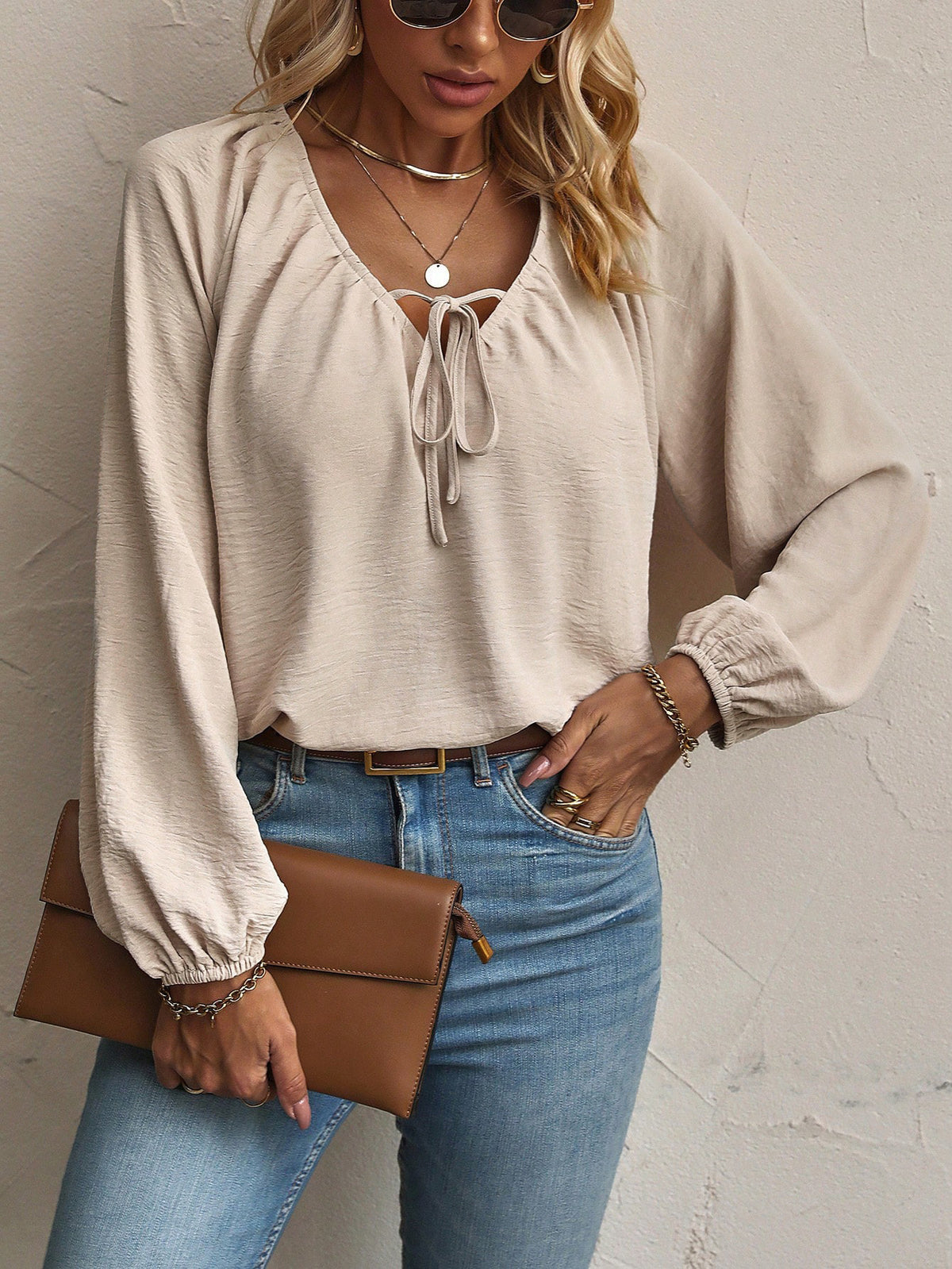 Polyester and spandex blend blouse in beige with relaxed silhouette