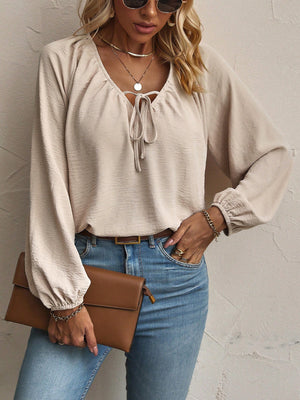 Polyester and spandex blend blouse in beige with relaxed silhouette