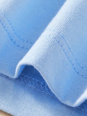 Blue cotton toddler t-shirt detail showing stitching and fabric texture.