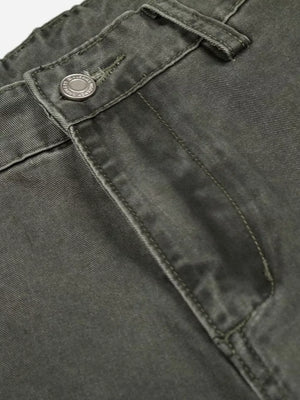 Green contemporary cargo pants with button fly detail and visible stitching.