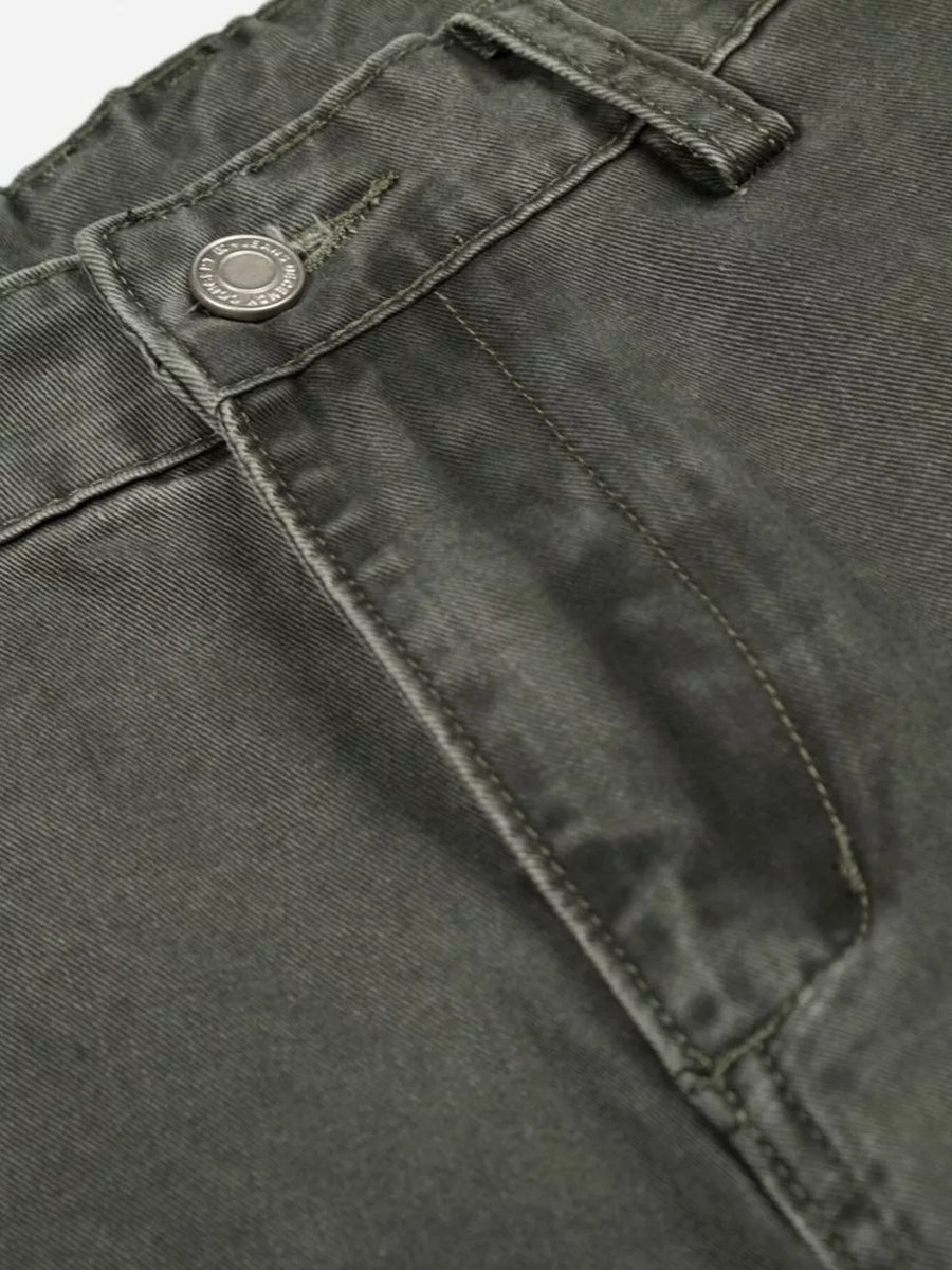 Green contemporary cargo pants with button fly detail and visible stitching.