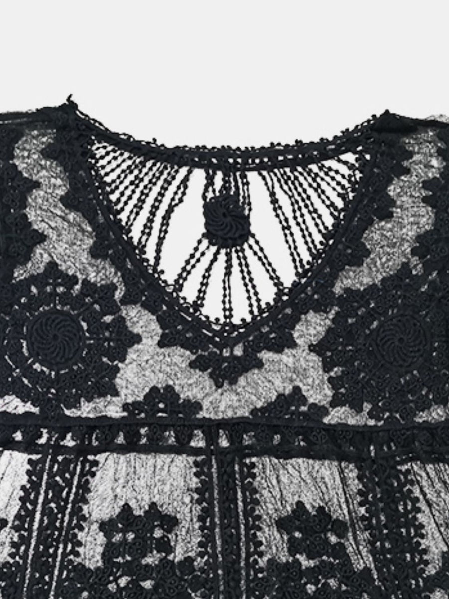 Black embroidered crochet kaftan cover-up with intricate floral details and a V-neckline.